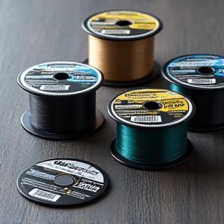 Various spools of fishing line and intricate leader setups.